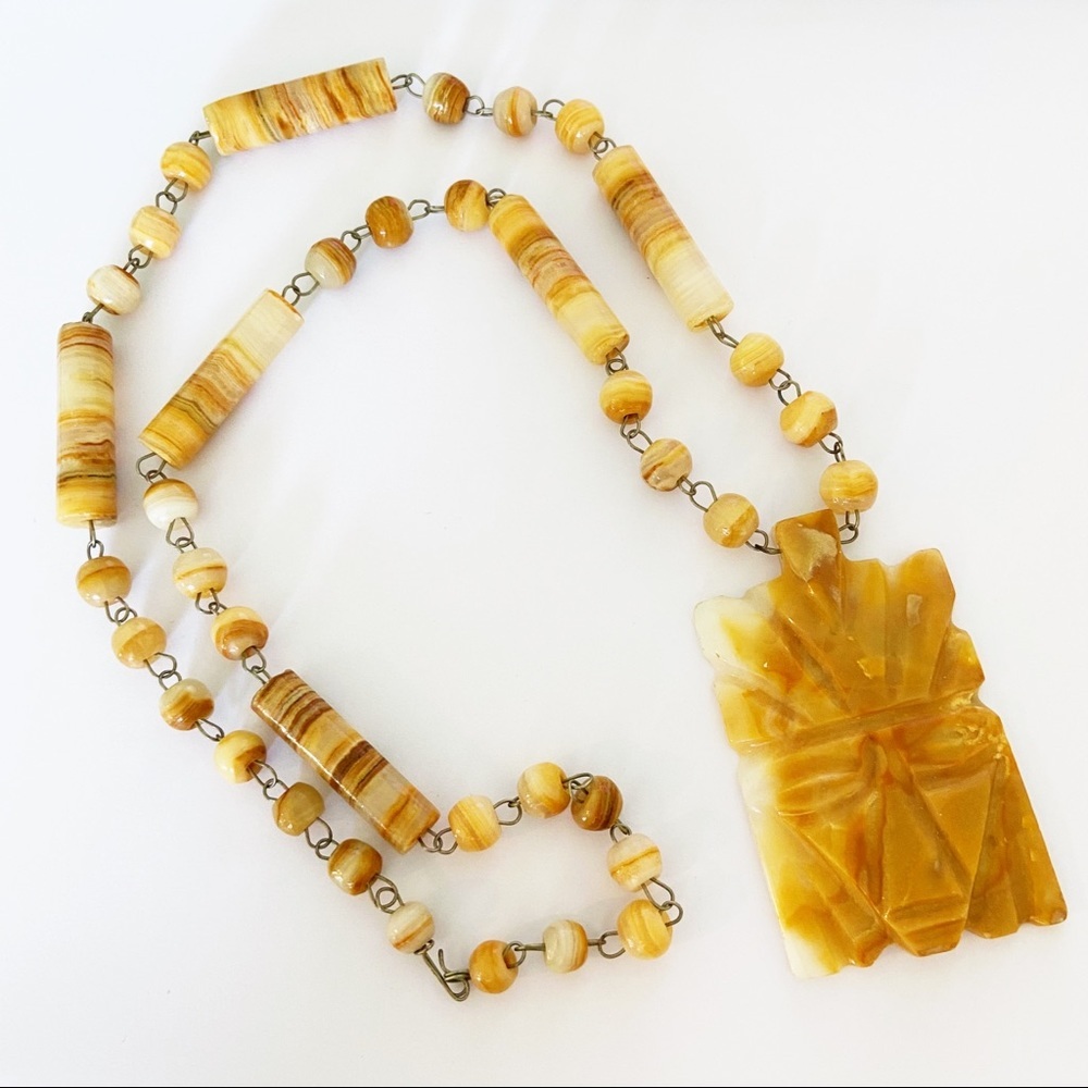 Vintage carved stone Mayan mask necklace - orange/ cream agate stones